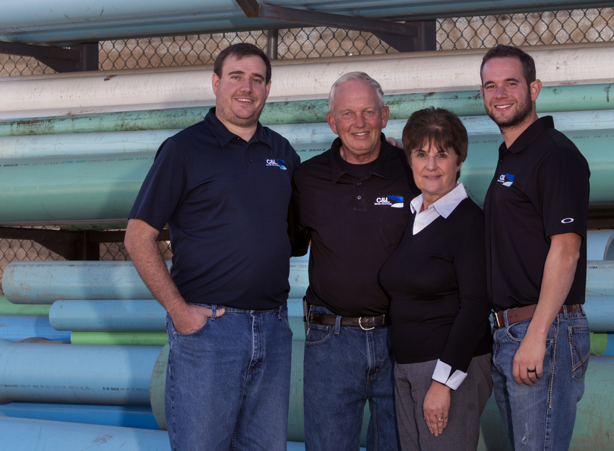 Larry and Chrystalla Larson (middle), founders of C&L Water Solutions in Littleton, Colorado, alongside sons Jason and Chris, who now run the company.